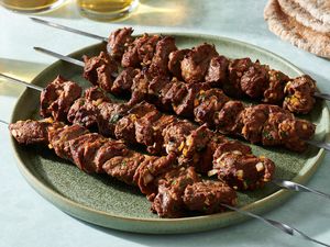 Classic Moroccan Lamb or Beef Kebabs (Brochettes) on a platter 
