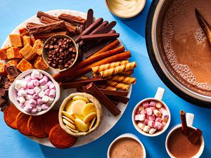 Crockpot Hot Chocolate, next to a platter with candy 