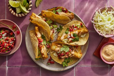 baja style fish tacos on plate with salsa