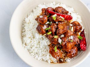 A bowl of General Tso's chicken served over rice