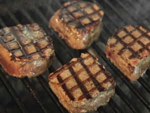 Beef steak grilled on a charcoal barbecue