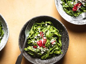 Tallarines Verdes (South American Green Noodles) in bowls 