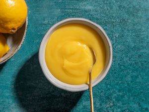 Instant Pot Lemon Curd in a bowl with a spoon 