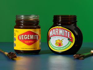 Vegemite and Marmite jars with butter knives