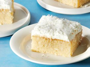 Southern Coconut Poke Cake slices on plates 