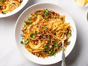 Pasta With Anchovies and Breadcrumbs in a bowl with a fork 