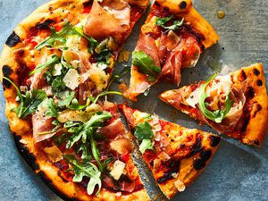 Prosciutto Pizza cut into slices