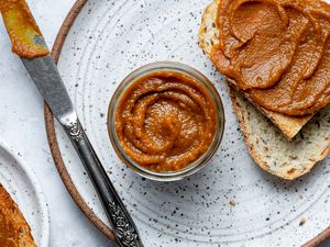 Pumpkin Butter in a bowl and on slices of bread on a plate 