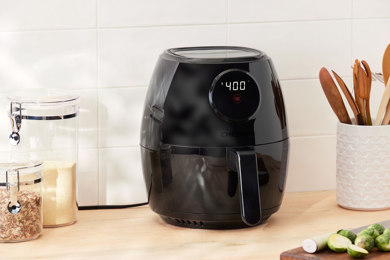 Chefman TurboFry 3.7-Quart Air Fryer displayed on a wood counter with a white tile background