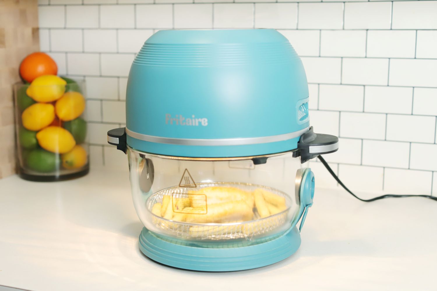 Fries cooking in the Fritaire Glass Bowl Air Fryer