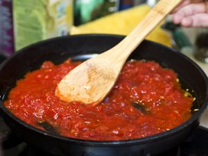 Stirring tomato sauce