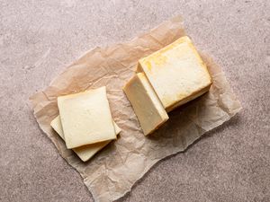 A block of Limburger cheese on parchment paper. 