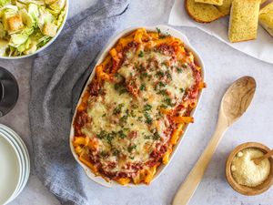 Baked ziti with ground beef and Italian sausage in a casserole dish