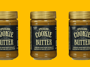 Three jars of Trader Joe's cookie butter against a yellow background